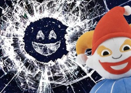 A-shattered-mirror-with-a-smiling-face-in-the-glass-from-Black-Mirror-marketing-overlayed-with-Balatros-Jimbo-plush.jpg