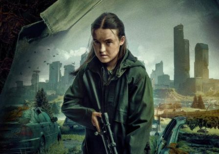 Bella-Ramsey-as-Ellie-in-promo-image-for-The-Last-of-Us-season-two.-She-is-holding-a-gun-and-looks-angry.-A-city-is-shown-behind-her.jpg