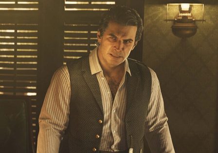 Male-character-in-Mafia-The-Old-Country-standing-in-a-darkened-but-plush-looking-home-office-type-room.jpg