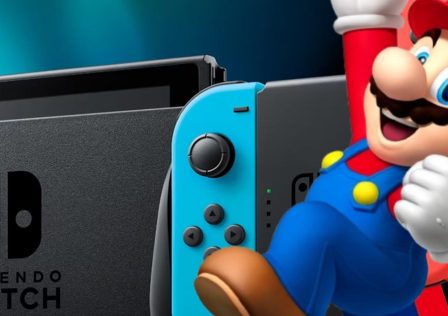 Nintendo-mascot-Mario-jumps-for-joy-in-front-of-a-Switch-console.jpg