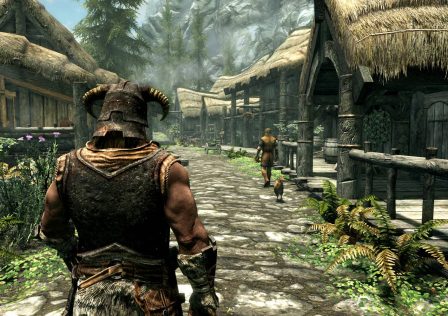 a-skyrim-character-walking-down-the-street-they-are-wearing-a-viking-like-helmet-the-buildings-are-made-of-wood.jpg