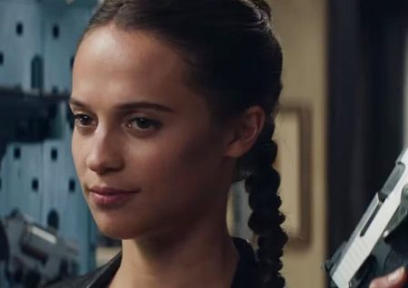 Alicia-Vikander-as-Lara-Croft-in-Tomb-Raider.-She-is-holding-a-gun-up-and-has-her-hair-in-a-long-braid.jpg