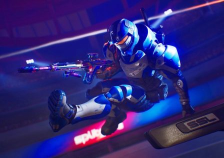 Splitgate-Arena-Reloaded-image-showing-a-player-character-leaping-over-an-obstacle-with-a-gun-in-hand.-The-background-is-largely-a-deep-blue.jpg