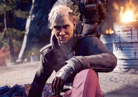 Pagen-Min-from-Far-Cry-4-looks-disappointed-as-he-sits-on-the-roadside-infront-of-a-burning-barrel.jpg