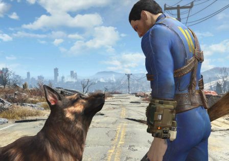 a-vault-dweller-looking-at-dogmeat-as-they-stand-on-a-ruined-road-in-fallout-4.jpg