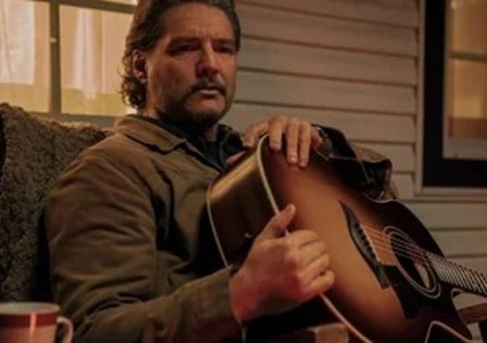 Pedro-Pascal-as-Joel-in-The-Last-of-Us.-He-is-holding-a-guitar-on-his-porch_8VtlBhU.jpg