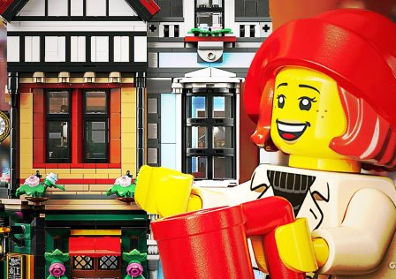 lego-minifigure-smiling-toward-large-modular-building-set.jpg