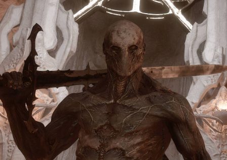 player-standing-in-front-of-a-large-structure-in-mortal-shell-2-1.jpg